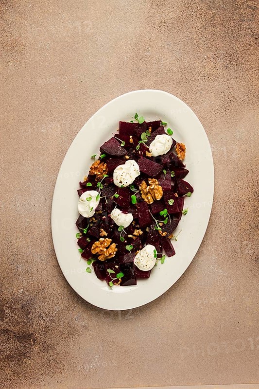 Beetroot salad with nuts, cream cheese and micro greenery, homemade, no people