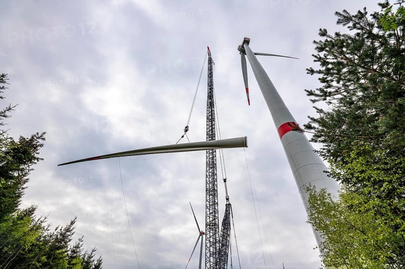 Erection of a wind turbine, wind energy plant, assembly of the third blade, with a crawler lattice crane, wind farm near Hagen, North Rhine-Westphalia, Germany, Europe