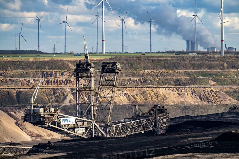 Opencast lignite mine Garzweiler 2, excavator 288, bucket wheel excavator, excavates lignite, considered the largest excavator in the world, behind the Niederaussem power plant, wind farm, near Jüchen, North Rhine-Westphalia, Germany, Europe