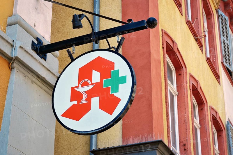 Heidelberg, Germany, July 28th 2024: Logo of German Pharmacy Association hanging from building, Europe