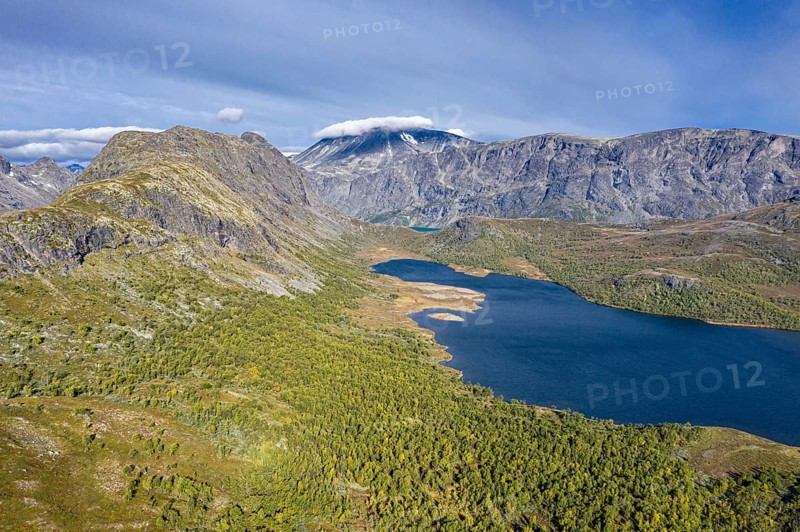 Aerial view of lake Ovre Leirungen, Mt. Besshø (or Besshøe) and famous Besseggen ridge in the back, meander of river Leirungsae, Jotunheimen National Park, Norway, Europe