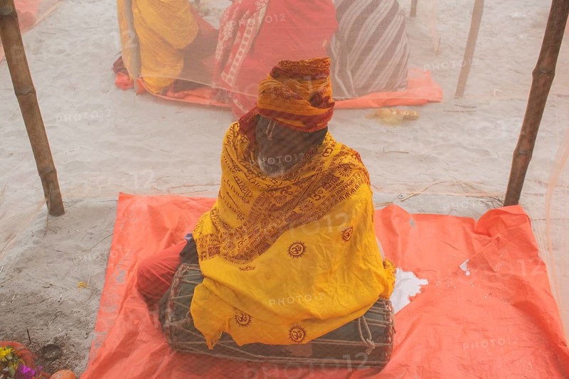 Devotees offer prayers at a tent city on the eve of consecration ceremony of the Ram temple, in Ayodhya, Uttar Pradesh, India on 22 January 2024