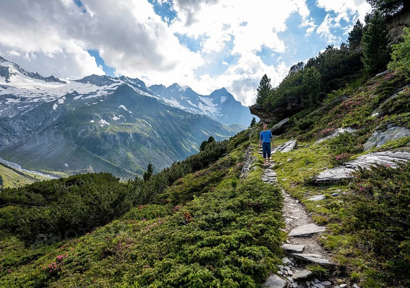 Mountaineer barefoot on a hiking trail, mountain landscape with Waxeggkees, Berliner Höhenweg, Zillertal Alps, Zillertal, Tyrol, Austria, Europe