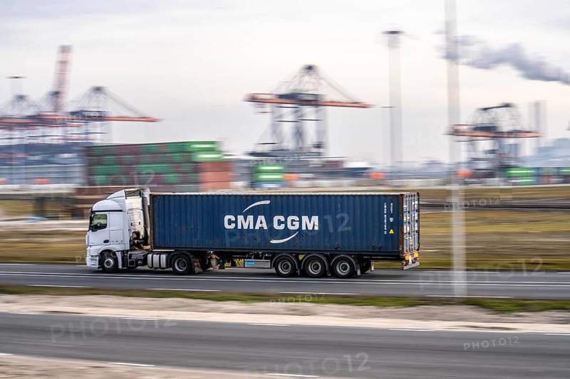 Container lorry, bringing containers to Euromax Container Terminal, the seaport of Rotterdam, Netherlands, deep-sea port Maasvlakte 2, on a man-made land area off the original coastline