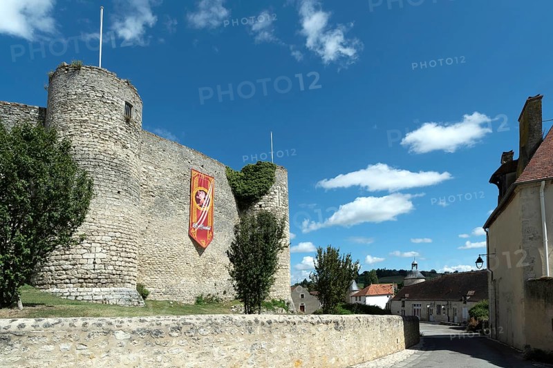 Billy. The fortress castle of the XIII Century, and its coloures banners of the houses of Hogwarts College (Harry Potter), Allier. Auvergne-Rhone-Alpes.France