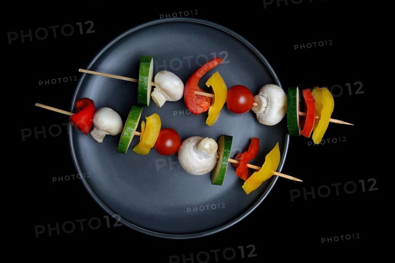 Colourful vegetable skewers on a plate, barbecue skewers