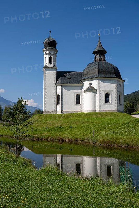 Seekirchl mi reflection, Heiligkreuzkirche, view from the parish hill, Seefeld, Tyrol, Austria, Europe
