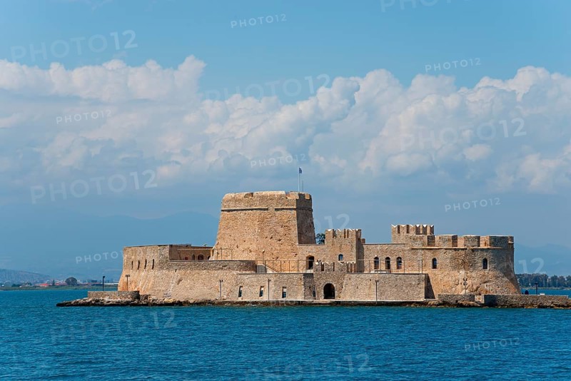 Old castle on a small island in the blue sea under a cloudy sky, fortress, Bourtz island, Bourtsi, Nafplio, Nauplia, Nauplion, Nafplion, Argolis, Argolic Gulf, Peloponnese, Greece, Europe