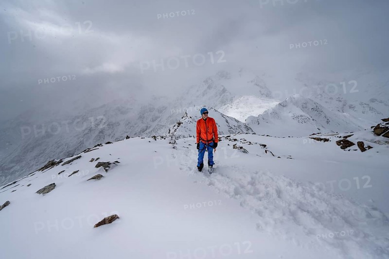 Ski tourers on the summit of the Köllkuppe or Cima Marmota, snow-covered mountain landscape, Ortler Alps, Vinschgau Valley, Italy, Europe