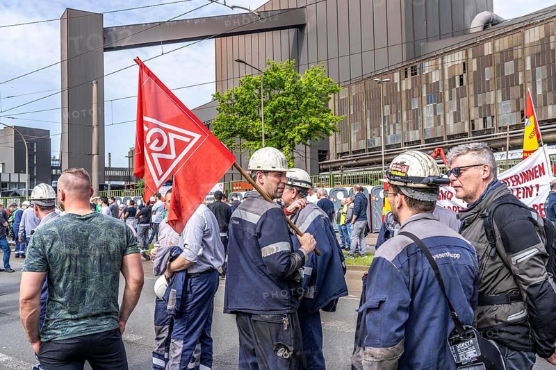 Steelworkers at a demonstration in front of the headquarters of ThyssenKrupp Steel Europe in Duisburg, against massive job cuts, after the participation of a foreign investor in the group, in the background the Oxygen steelworks, Duisburg North Rhine-Westphalia, Germany, Europe