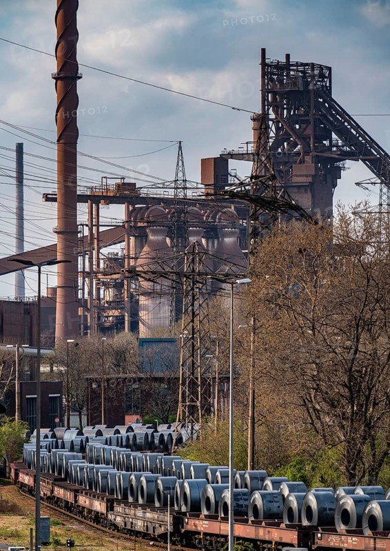 Blast furnace Schwelgern 2, strip steel rolls, coils, on freight wagons, at the ThyssenKrupp Schwelgern plant in Duisburg-Marxloh, part of the Bruckhausen steelworks, North Rhine-Westphalia, Germany, Europe