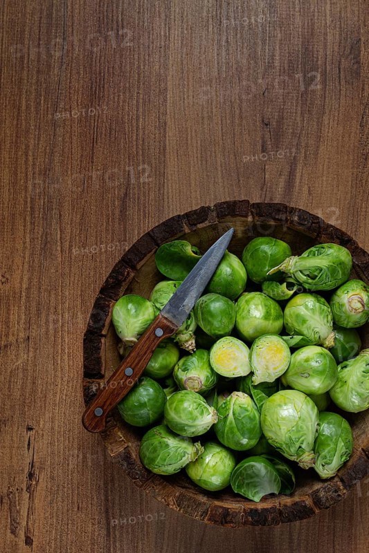 Fresh Brussels sprouts, raw, top view, on a wooden table, no people