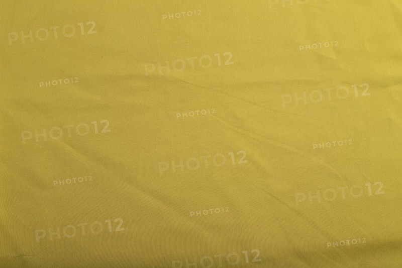 Fragment of smooth green olive silk tissue. Top view, flat lay, natural textile background and texture