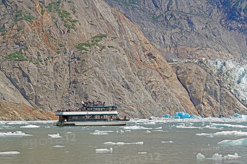 Tourist boat in Tracy Arm Fjord, icebergs and rugged Alaska, USA, North America