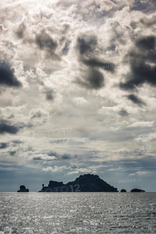 Island landscape with dramatic thunderstorm sky, thunderstorm, storm, stormy, cloudy, gloomy, weather, sky, dark, dark, storm clouds, threatening, nature, force of nature, sea, ocean, island, seascape, travel, tourism, seascape, climate, climate change, horizon, environment, atmosphere, danger, meteorology, weather forecast, rain, grey, dramatic, tropical, tropical rain, monsoon, season, season, Krabi, Thailand, Asia
