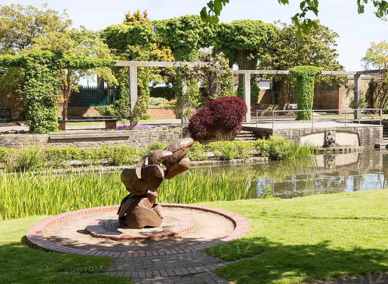 Sculpture water feature and gardens in Queen's Park, central Swindon, Wiltshire, England, UK