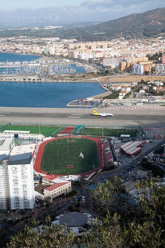 View over airport runway to Spanish town of La Linea from Gibraltar, British overseas territory in southern Europe