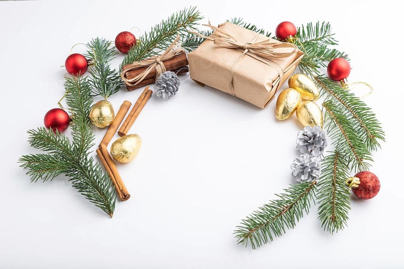 Christmas or New Year wreath composition. Decorations, balls, fir and spruce branches, on white background. Side view, copy space