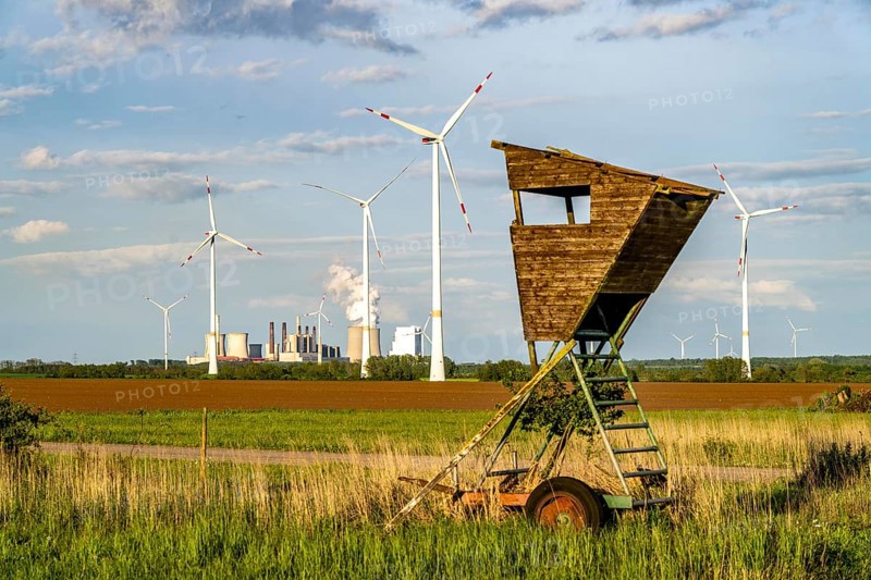 RWE wind farm near Bedburg, at the Garzweiler open-cast mine, on recultivated part of the open-cast lignite mine, Nordex N163 wind turbine, in the background the Neurath lignite-fired power station, North Rhine-Westphalia, Germany, Europe