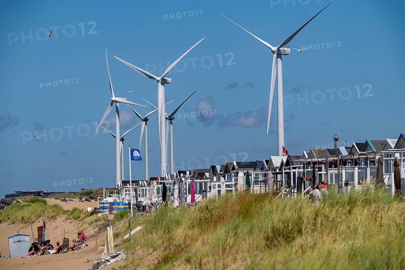 Wind turbines, wind farm, holiday homes, beach houses on the beach of Ijmuiden in North Holland, Netherlands
