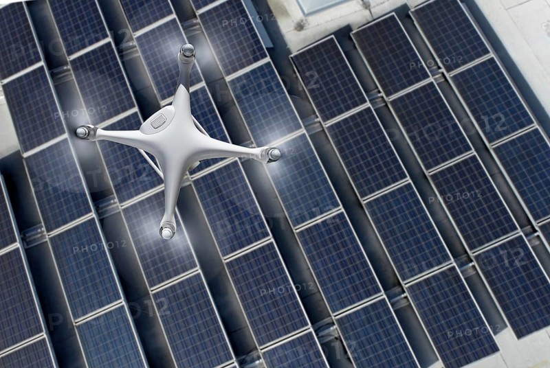 Quadcopter UAV drone flying A solar panel roof inspection