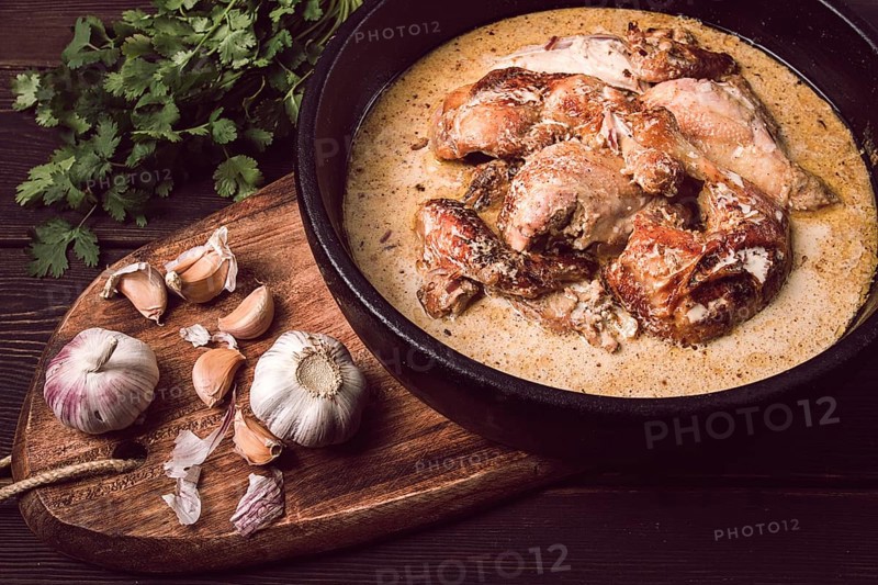 Shkmeruli, fried chicken, in milk-garlic sauce, Georgian cuisine, homemade, close-up, no people