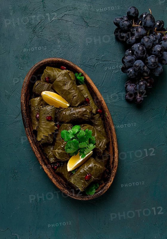 Dolma (Tolma) stuffed rolls, minced meat with rice, in grape leaves, top view, no people, close-up