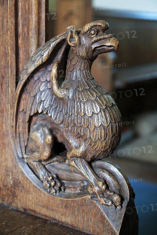 Carved wooden pew end figure, Huntingfield church, Suffolk, England, UK