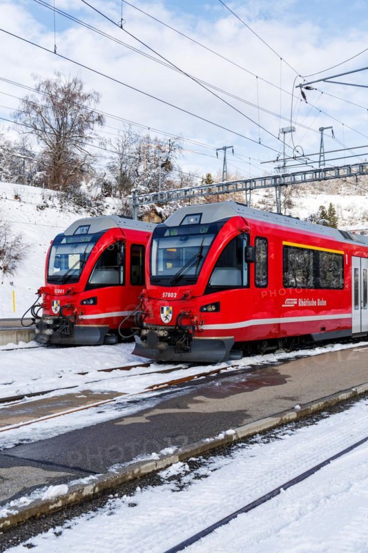 Rhaetian Railway trains on the Albula railway Stadler Rail passenger train at Filisur station, Switzerland, Europe
