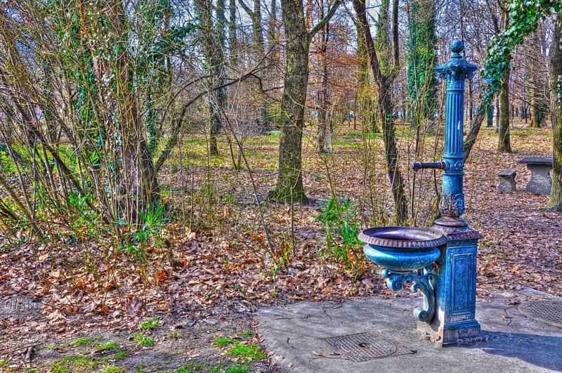 Old Blue Beautiful and Elegant Water Fountain in the Forest in Locarno, Ticino, Switzerland, Europe