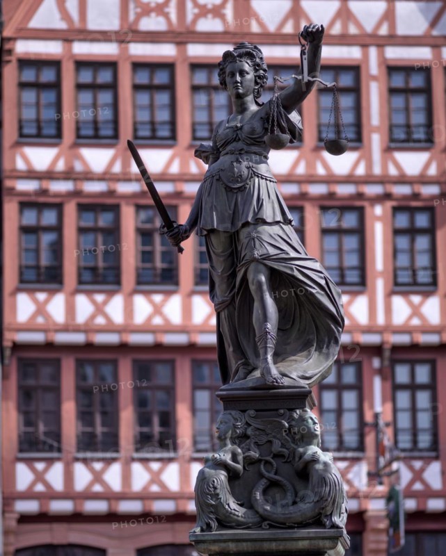 Justitia, Roman goddess of justice, with scales but without blindfold, in front of half-timbered house on Römerberg, Old Town, Frankfurt am Main, Hesse, Germany, Europe