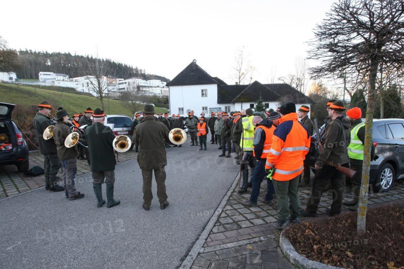 Hunters and hunting assistants, so-called beaters, in front of the start of the hunt, address by hunting guide, Lower Austria, Austria, Europe