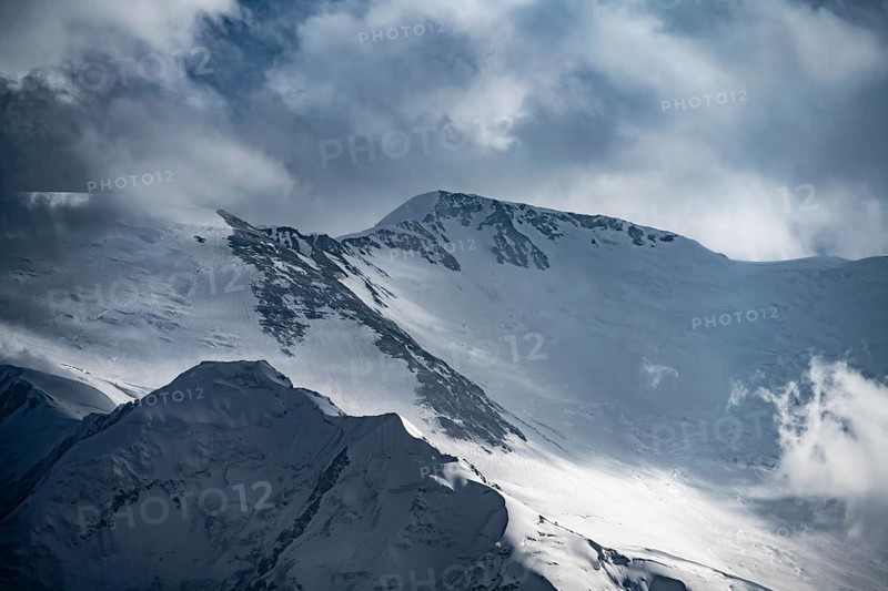 Dramatic mountain landscape, mountain valley, behind glaciated and snow-covered mountain peak Pik Lenin, Trans Alay Mountains, Pamir Mountains, Osh Province, Kyrgyzstan, Asia
