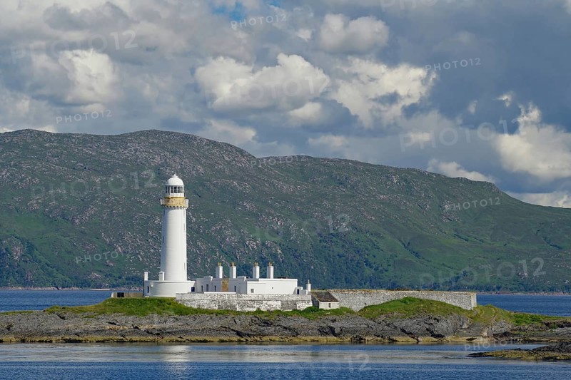 Lighthouse and building on an island, surrounded by the sea, under a cloudy sky, Lismore Lighthouse, Stevenson Family, Oban, Scotland, United Kingdom, Europe