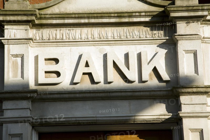 Stone lettering Bank above entrance to building, England, UK