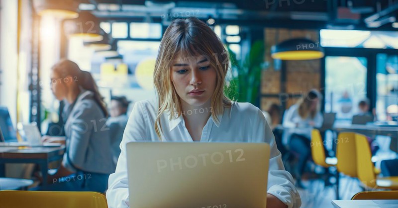 A business woman is sitting at a table with a laptop in front of her working remotely with the team at the cafe, AI generated
