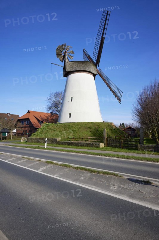 Windmill Hummelbecker Mühle under a cloudless blue sky, a Wall-Holländer, is part of the Westphalian Mill Road in Dützen, Minden, Mühlenkreis Minden-Lübbecke, North Rhine-Westphalia, Germany, Europe