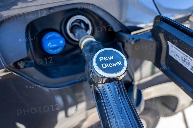 Diesel car is refuelled with diesel fuel, petrol station