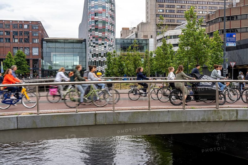 Central cycle path on the Vredenburgviaduct, at the Hoog Catharijne shopping centre, behind Utrecht Centraal station, in the city centre of Utrecht, heavy traffic, Netherlands