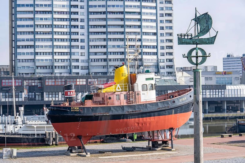 Old harbour, harbour basin, harbour district, museum ships, harbour tugboat Stier, part of the Harbour Worlds, high-rise buildings at the Columbus Center, in Bremerhaven, Bremen, Germany, Europe