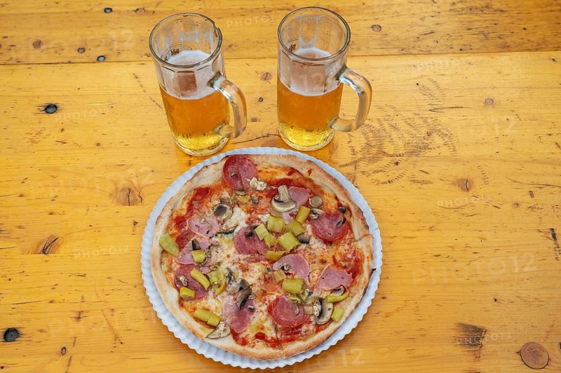Pizza and two beers on a beer table at a party Italian night in Sylbacxh, Lower Franconia, Bavaria, Germany, Europe