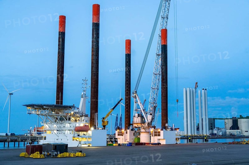 Buss-Terminal Eemshaven, logistics hub for the offshore wind farm industry, from here new wind farms in the North Sea are supplied with equipment, monopiles and transition pieces, which are anchored in the seabed and form the platform for the actual wind turbines, in the industrial harbour of Eemshaven, wind farm, Groningen, Netherlands