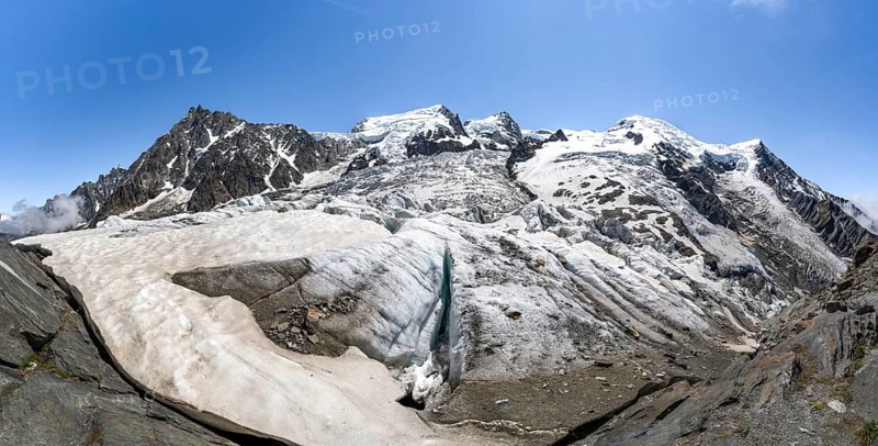 High alpine glaciated mountain landscape, La Jonction, Glacier des Bossons meets Glacier de Taconnaz, summit of Aiguille du Midi, Mont Maudit and Mont Blanc, Chamonix, Haute-Savoie, France, Europe