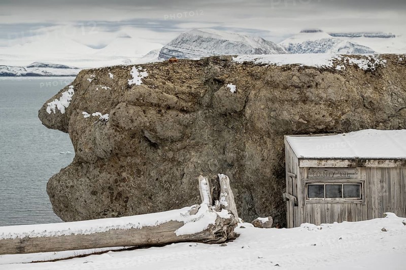 Driftwood and shed labelled County Jail, prison, Ny-Ålesund, Kongsfjord, Spitsbergen Island, Svalbard and Jan Mayen archipelago, Norway, Europe