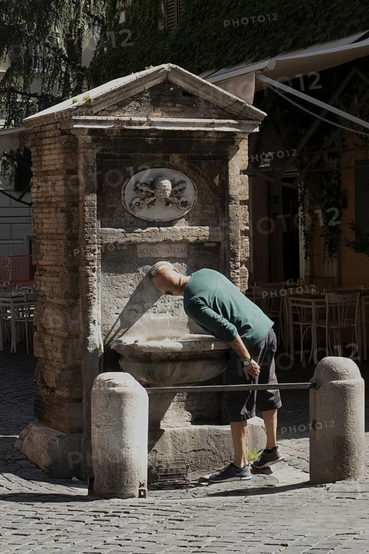 Public drinking water fountain in the historic centre of Rome, Italy, Europe