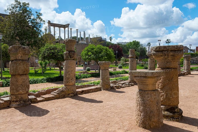 Ancient stone columns and ruins in a green garden under a sunny sky, a remnant of Roman architecture, Mérida, Merida, Badajoz, Extremadura, Spain, Europe