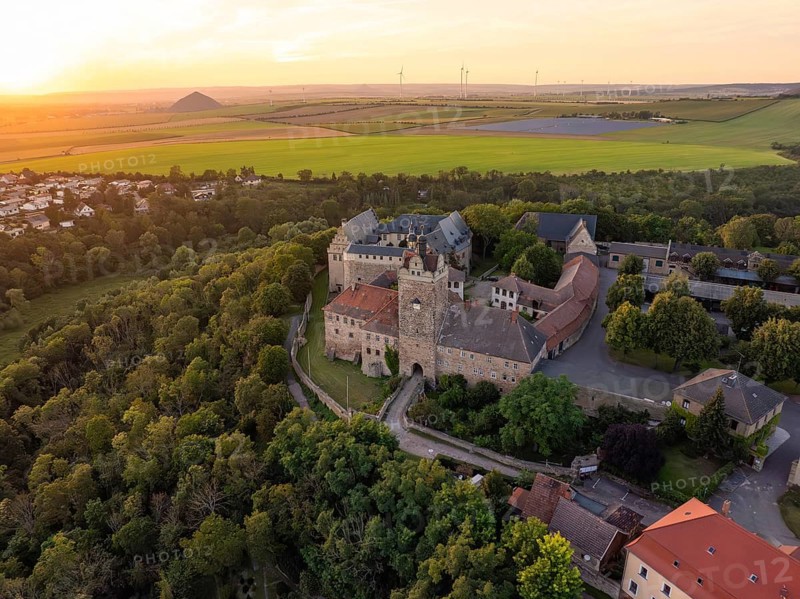 Historic castle surrounded by forests and fields in the evening light, Allstedt, Harz, Germany, Europe