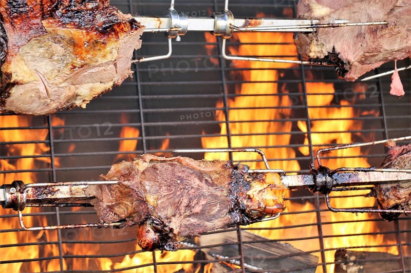 Suckling pig leg on the spit