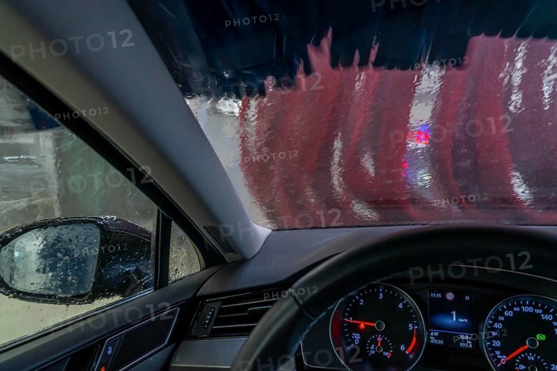 Car in an automatic car wash, car wash tunnel