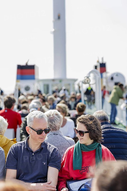 Tourists on the ferry Münsterland operated by shipping company AG Ems, crossing from the mainland to Borkum, which is fuelled by gas instead of heavy fuel oil. Eemshaven, 17.05.2024
